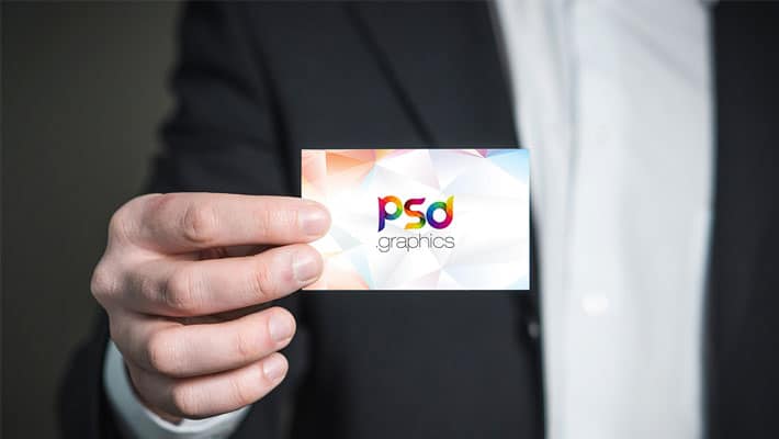 Business Card Holding in Hand Mockup PSD