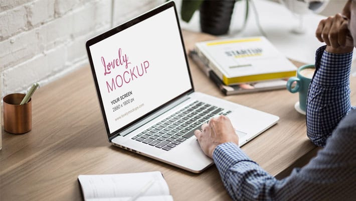 Man Working On His Macbook