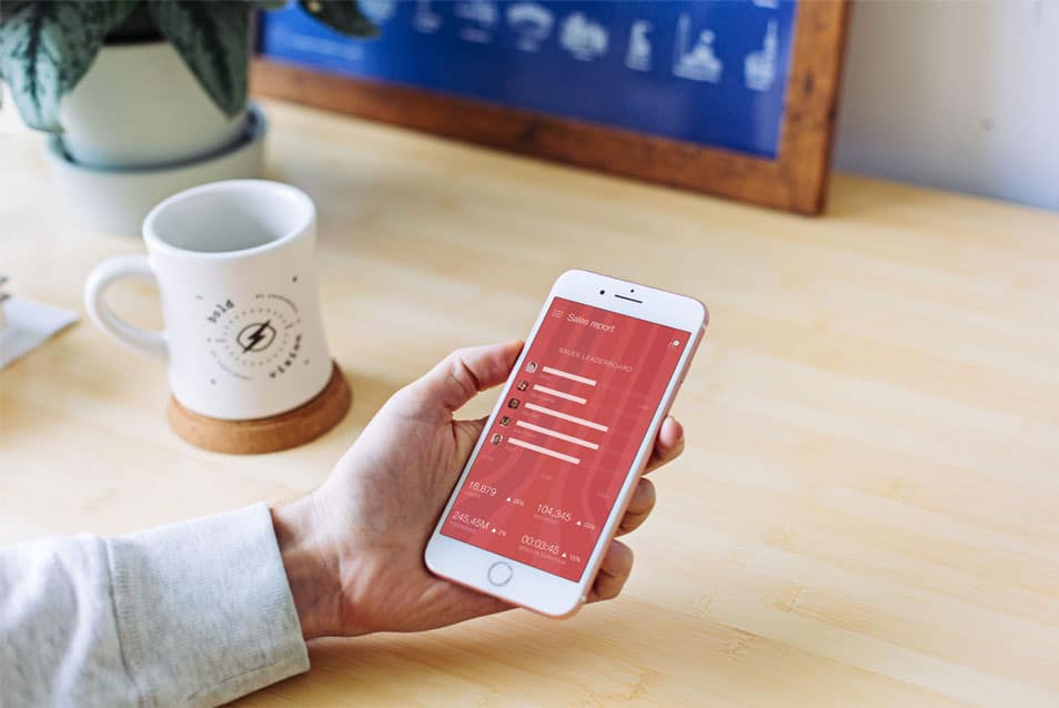 White iPhone in Man’s Hand