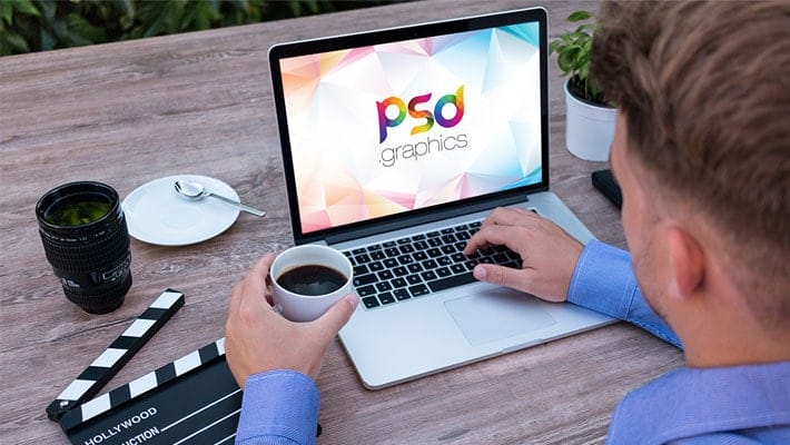 Man Working on Macbook Mockup PSD
