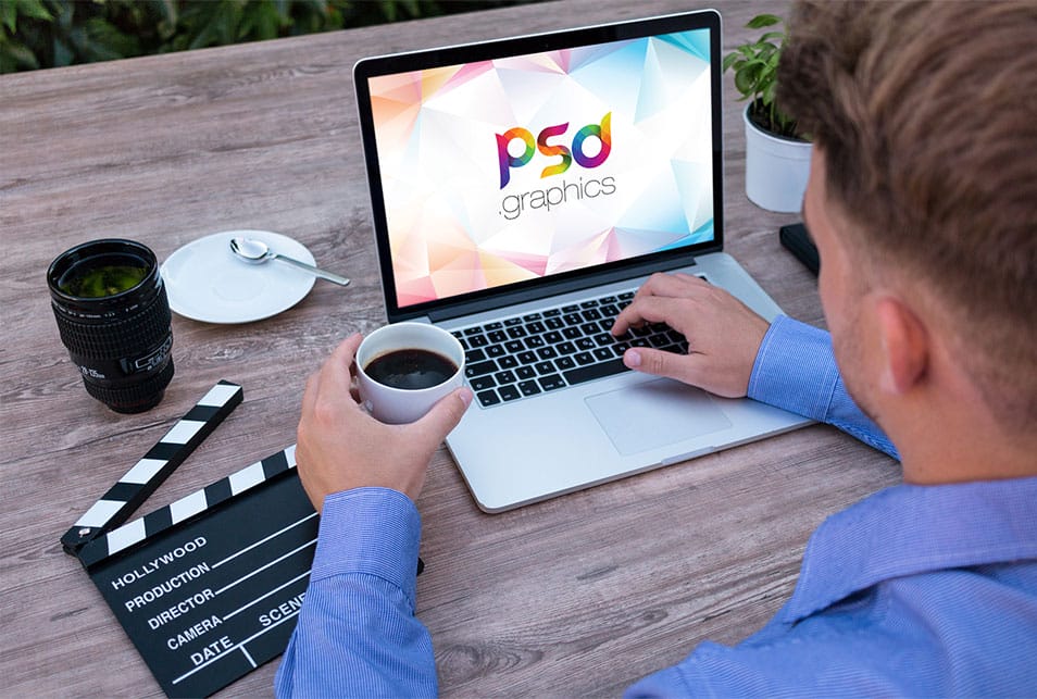 Man Working on Macbook Mockup PSD