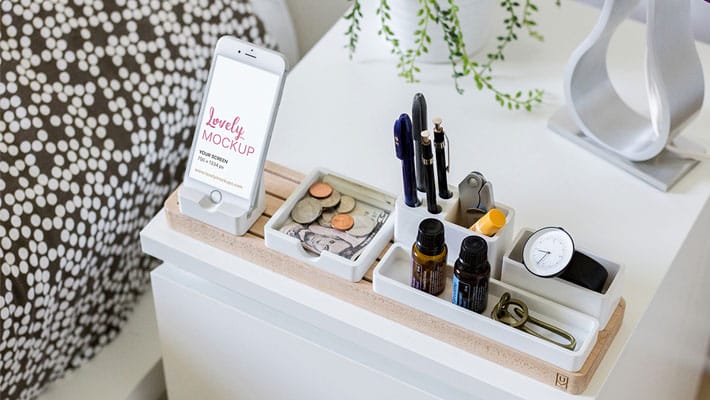 White iPhone on Nightstand