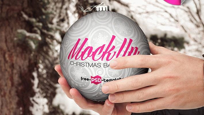 Free Christmas Ball Hand Hold Mock-up in PSD