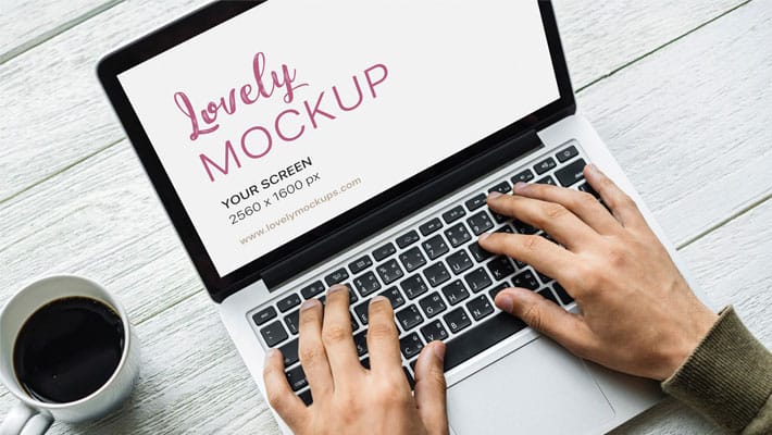 Macbook Mockup With Black Coffee On The Table