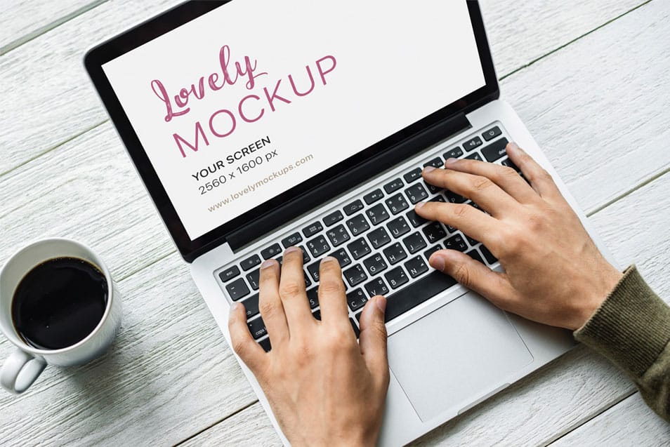 Macbook Mockup With Black Coffee On The Table