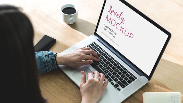 Macbook Mockup Of A Woman While Coding