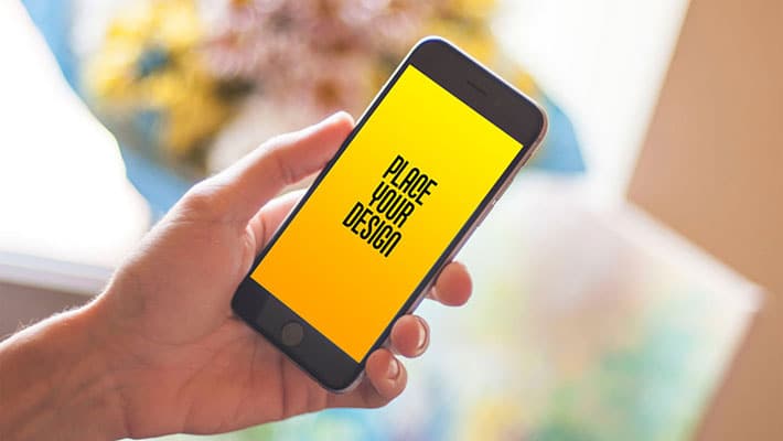 Free Mobile in Hand Smartphone Photo Mockup PSD