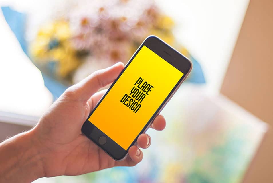 Free Mobile in Hand Smartphone Photo Mockup PSD