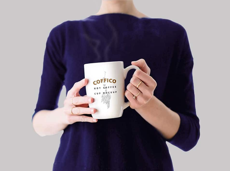 Woman Holding a Coffee Mug Mockup PSD