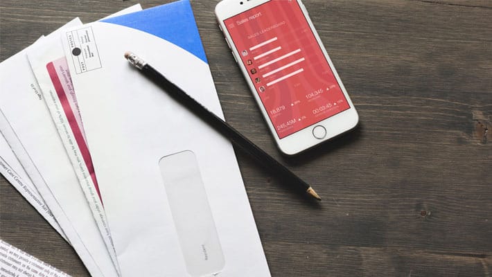 iPhone Mockup With Bills and Receipts on Table