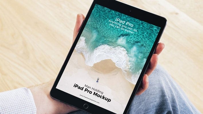 Free Man Holding iPad Pro Mockup