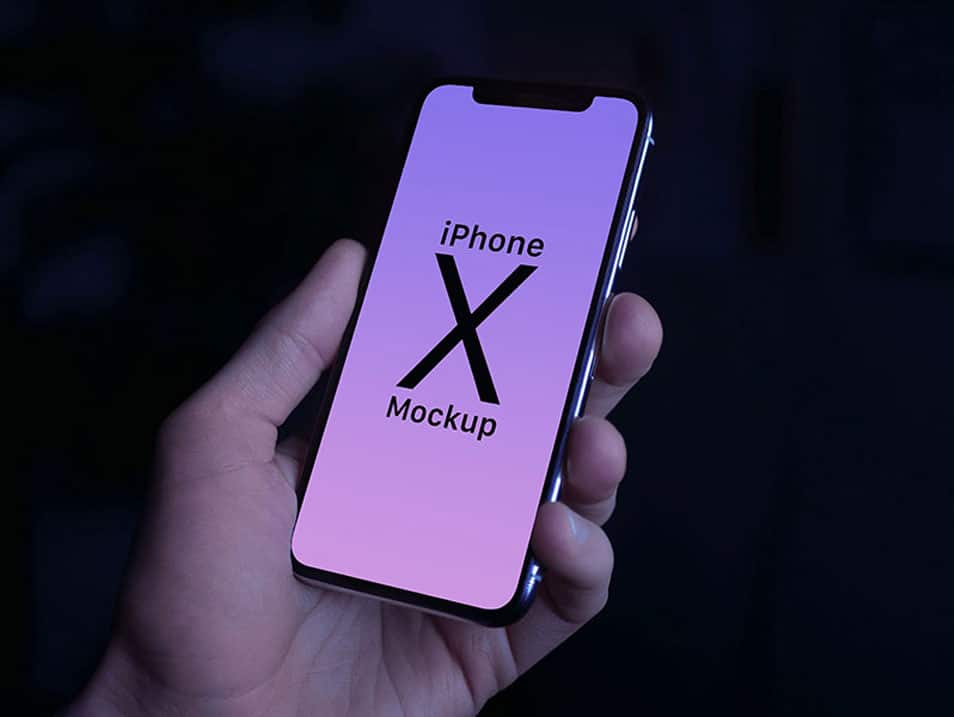Free iPhone X in Male Hand Photo Mockup PSD