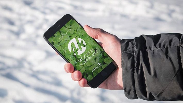 Free iPhone in Hand PSD MockUp in 4k