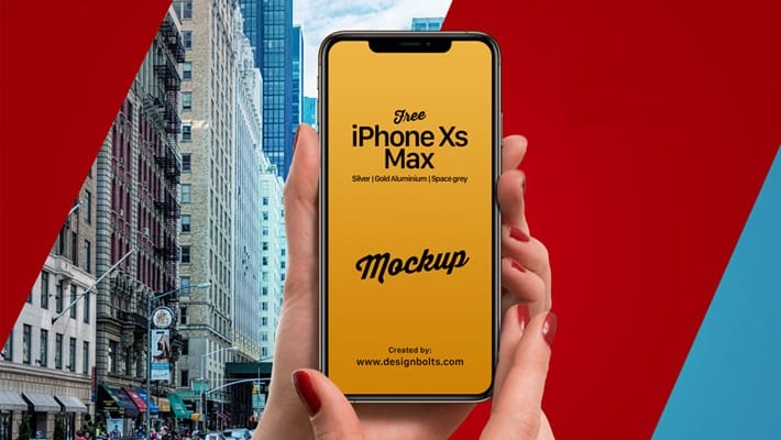 Free iPhone Xs Max in Female Hand Mockup PSD