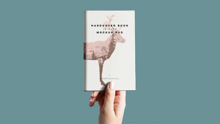 Hardcover Book In Hand Mockup