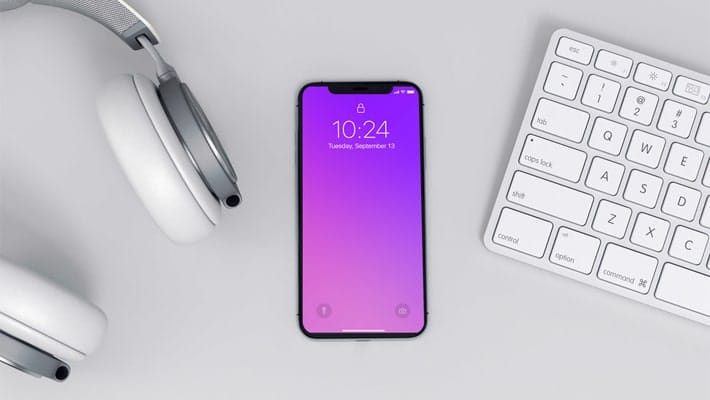 Modern iPhone x Mockup on a Workspace