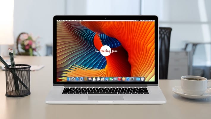 Free Apple MacBook Pro Retina on Workstation Mockup