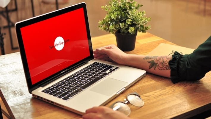 Free Girl Using MacBook Pro Mockup