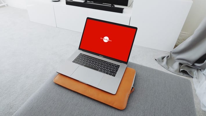 Free MacBook Pro in Living Room Mockup
