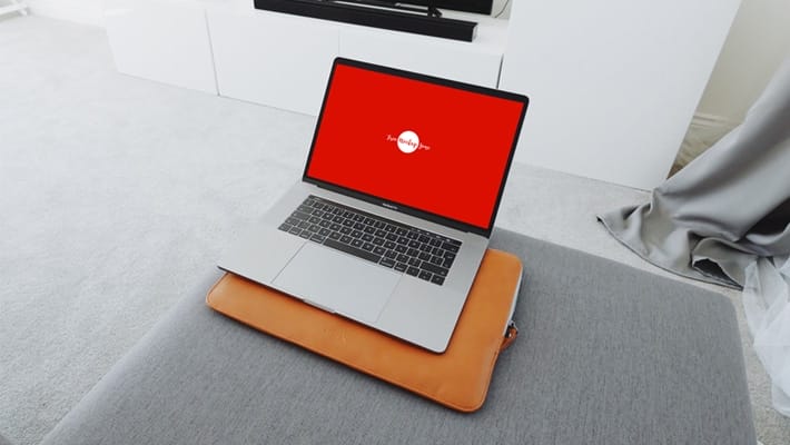 Free MacBook Pro in Living Room Mockup