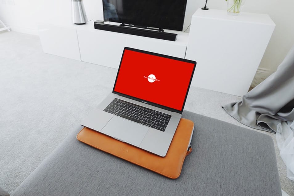Free MacBook Pro in Living Room Mockup