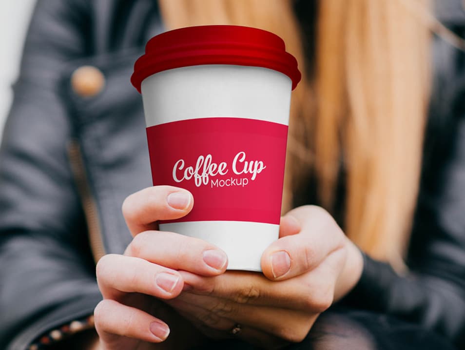 Free Paper Coffee Cup in Hand Mockup PSD
