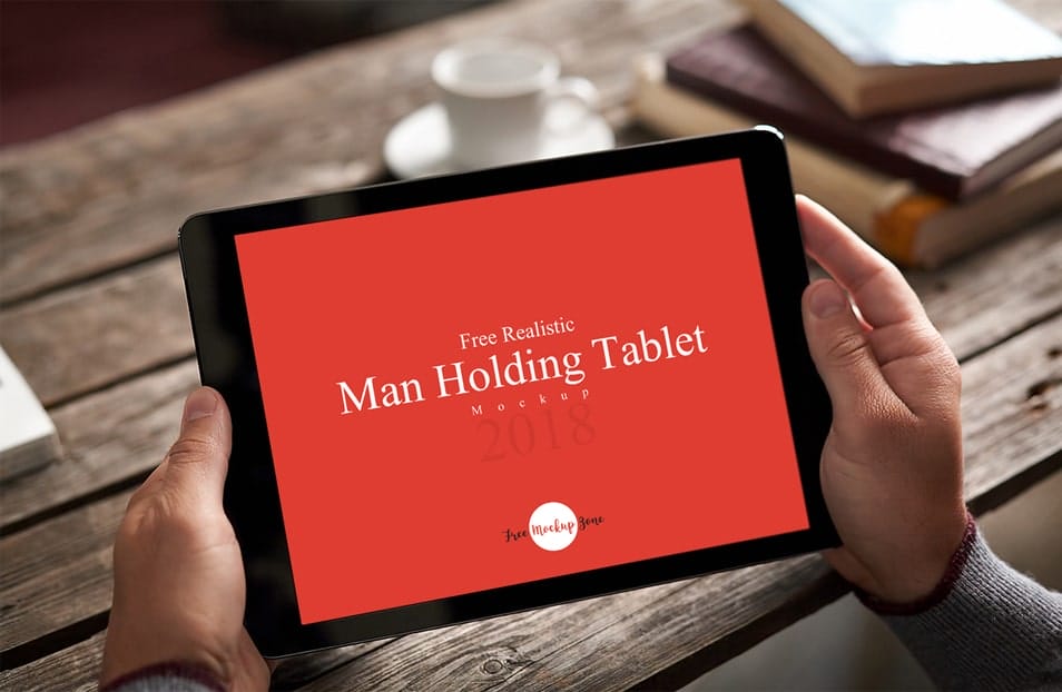 Free Realistic Man Holding Tablet Mockup