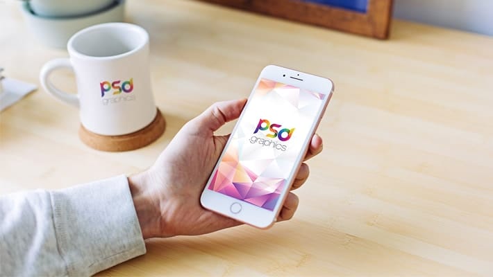 Male Holding iPhone Mockup PSD