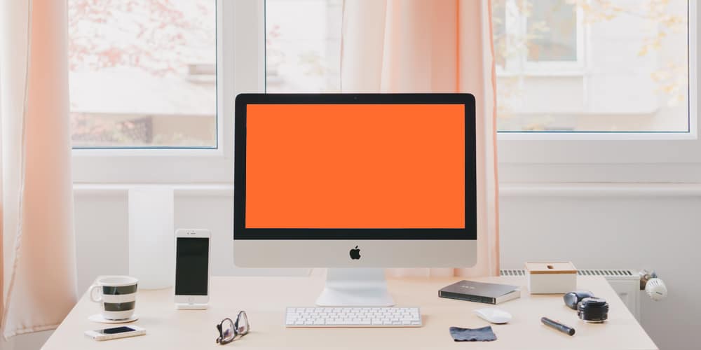 iMac on Desktop Mockup Template PSD