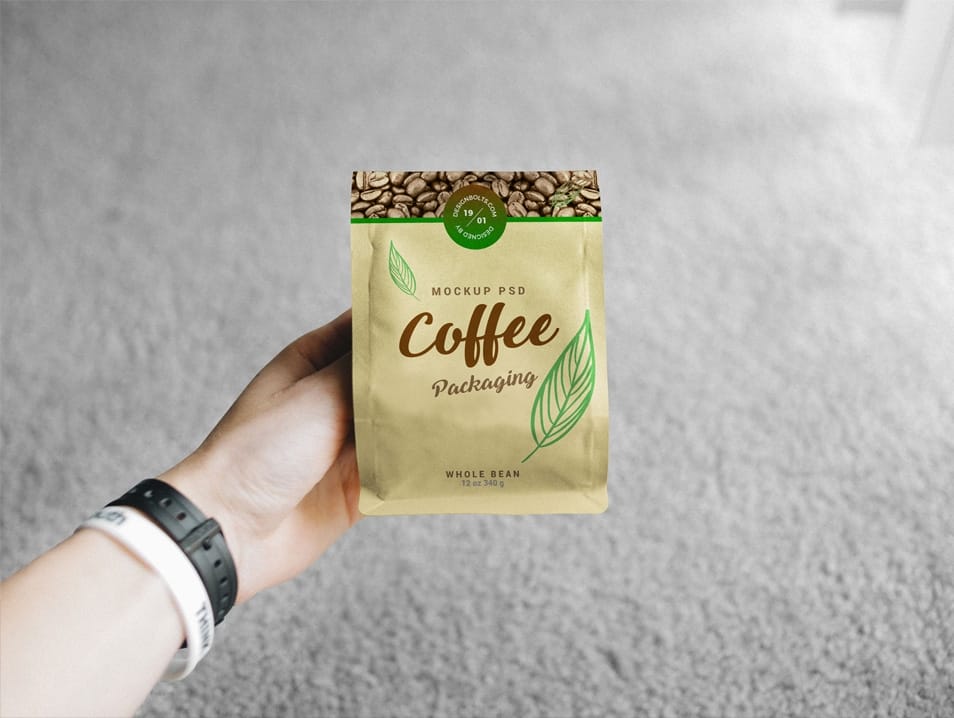 Free Hand Holding Coffee Bag Packaging Mockup PSD