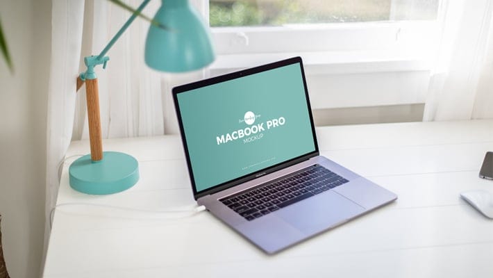 Free Home Office Desk With MacBook Pro Mockup PSD