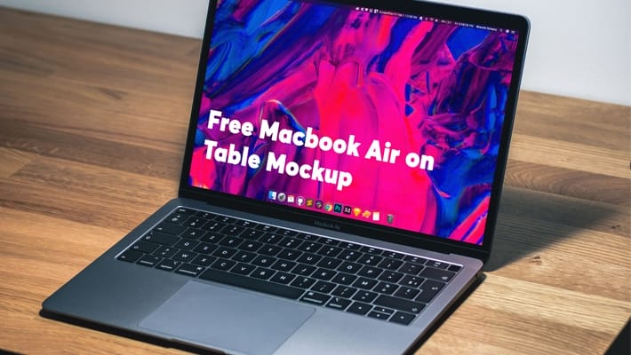 Free Macbook Air on Table Mockup