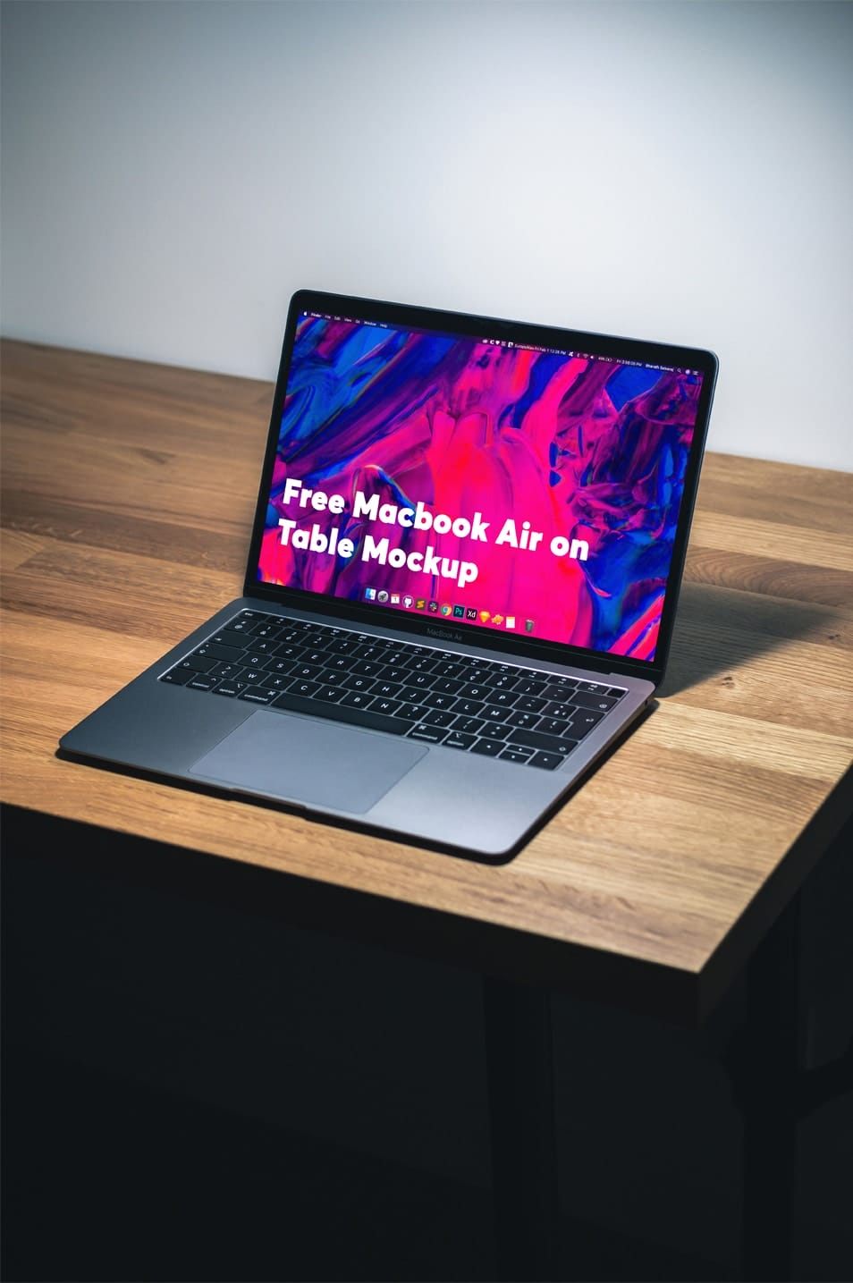 Free Macbook Air on Table Mockup