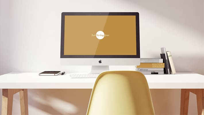 Free iMac Pro on Designer Table Mockup PSD