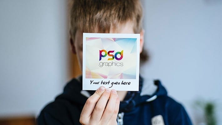 Holding Polaroid Photo Mockup PSD