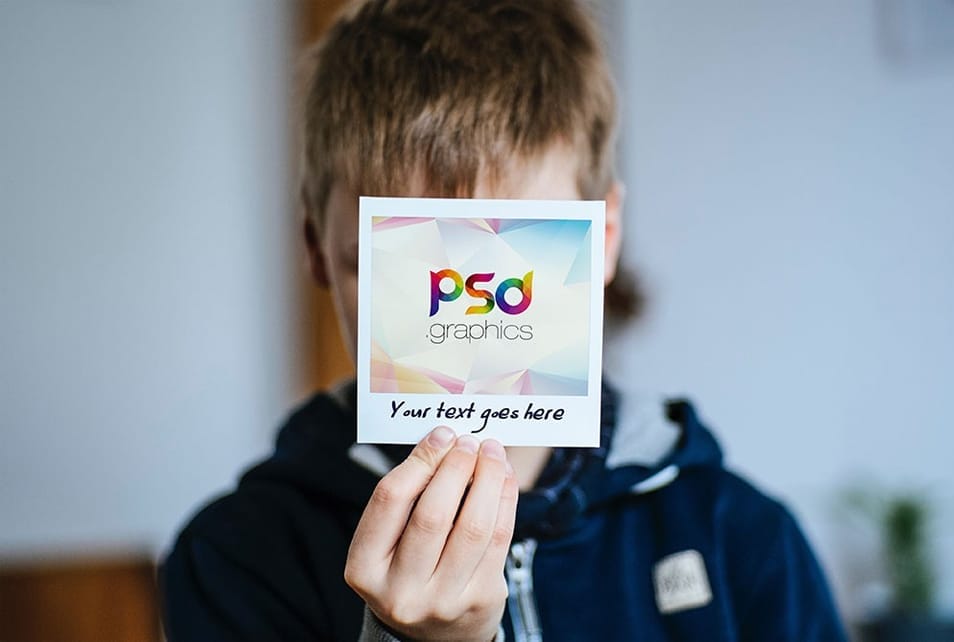 Holding Polaroid Photo Mockup PSD