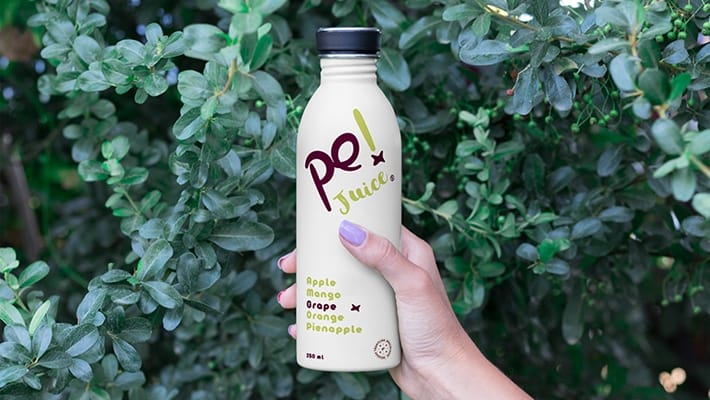 Hand Holding Bottle Mockup