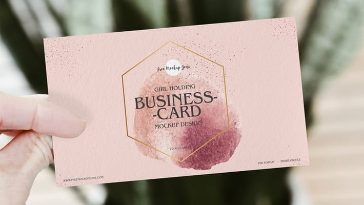 Free Girl Holding PSD Business Card Mockup Design