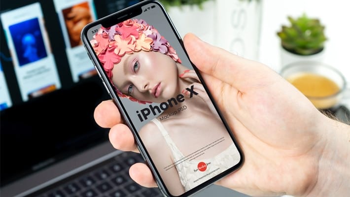 Free Man Holding in Hand iPhone X Mockup PSD