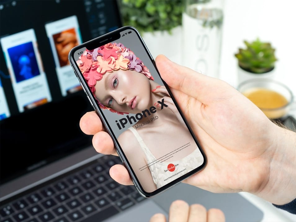 Free Man Holding in Hand iPhone X Mockup PSD