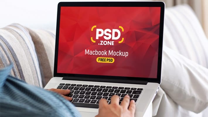 Man Typing on Macbook Pro Mockup PSD