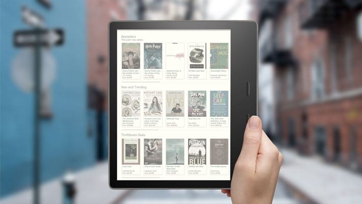 Free Kindle Oasis In Hand Mockup PSD