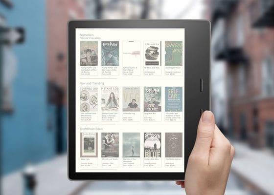 Free Kindle Oasis In Hand Mockup PSD