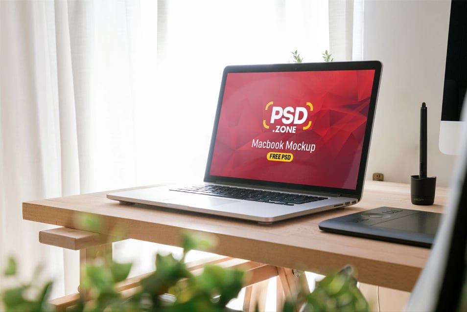 Macbook Pro on Wooden Table Mockup PSD