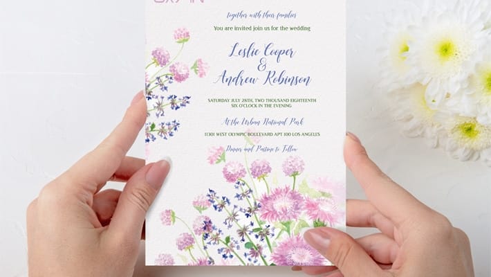 Free Wedding Invitation held in Hands Mock-up in PSD