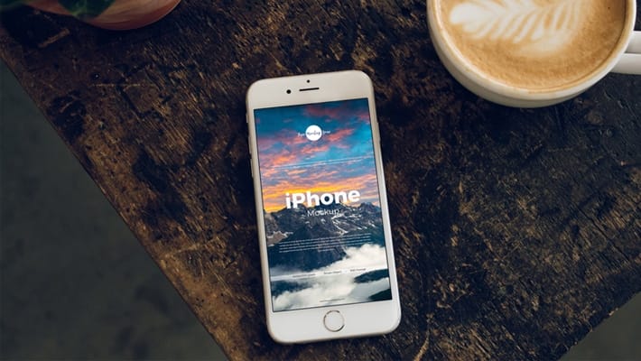 Free iPhone With Coffee Cup Mockup