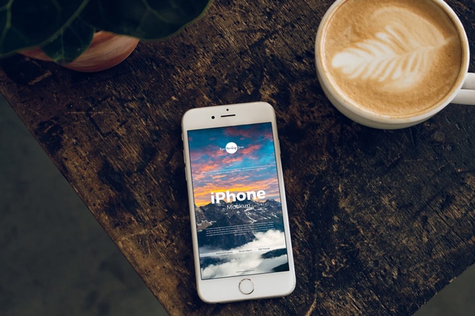 Free iPhone With Coffee Cup Mockup