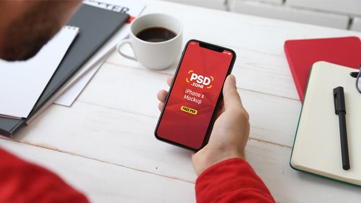 Holding iPhone X Mockup PSD