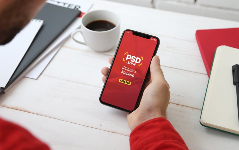 Holding iPhone X Mockup PSD