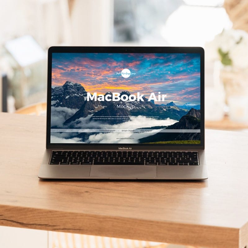 Free Interior MacBook Air on Table Mockup
